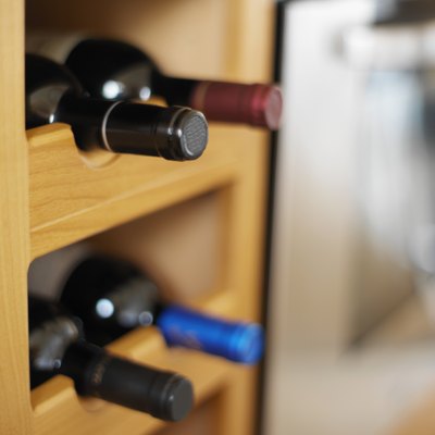 close-up of wine bottles on shelves