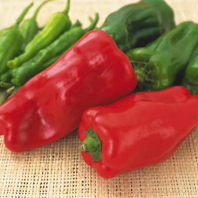 Closed Up Image of Two Red Bell Peppers, Surrounded By Different Peppers, High Angle View, Differential Focus