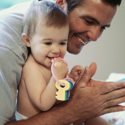 Side profile of a father playing with his daughter
