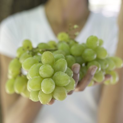 Woman holding grapes