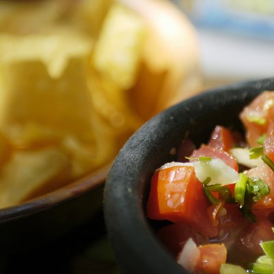 Bowl of salsa and tortilla chips at Mexican Restaurant