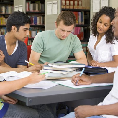 Five people in library studying (selective focus)