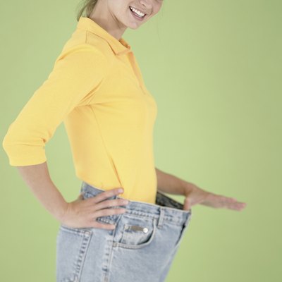 Woman wearing pants that are too big for her