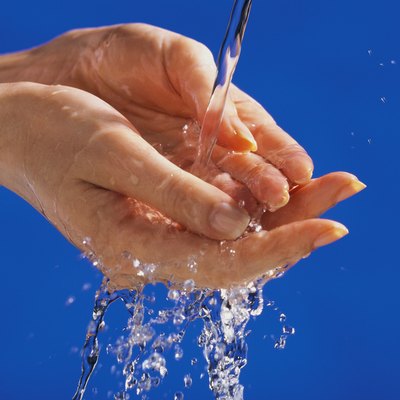 Hands under running water
