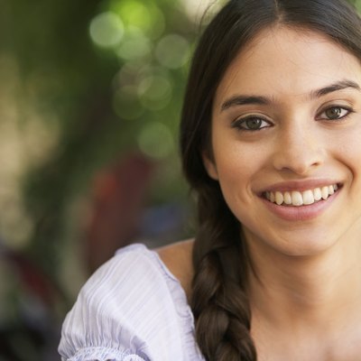 Young woman smiling, portrait, close-up
