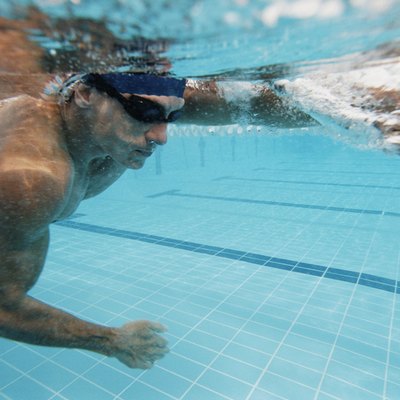 Underwater Shot of a Young Man Swimming in a Pool