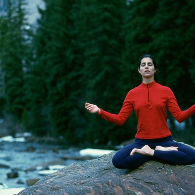 Young woman meditating in the lotus position