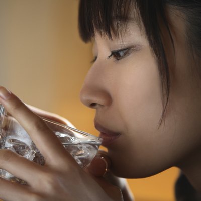 Close-up of Young Woman Drinking Water