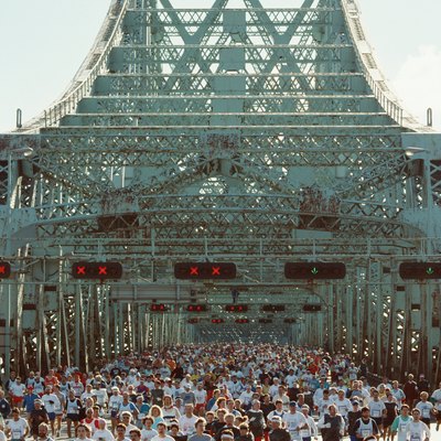 People running marathon on bridge