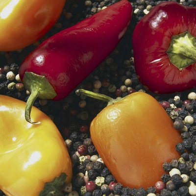 Assorted chili peppers on peppercorns