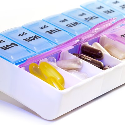 Closeup view drugs in box with separations for each day