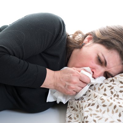 Middle age woman suffering from cold