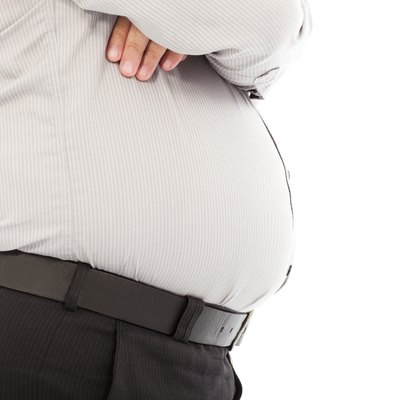 close-up fat business man standing and hands across