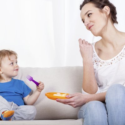 Mum and child eating meal together