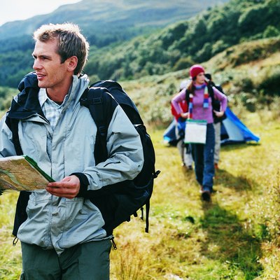 Two Young Adults Leave Their Tent to go Orienteering