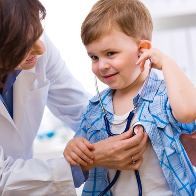 Doctor examining child