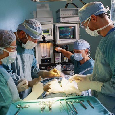 Surgical team performing operation