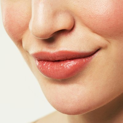 Young woman smiling, close-up