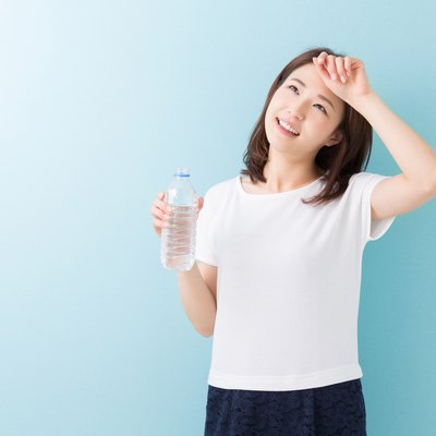 Japanese woman holding water bottle
