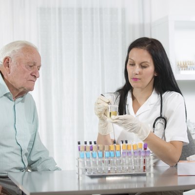Doctor passes urine cups to patients