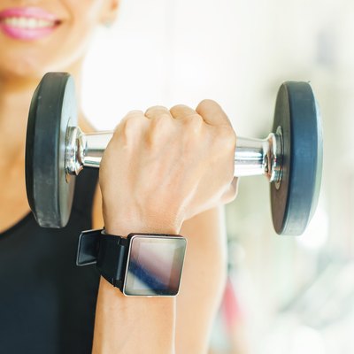 Smart watch on women hand in gym