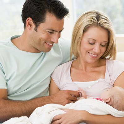 Couple in living room with baby