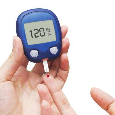 Woman doing blood sugar test