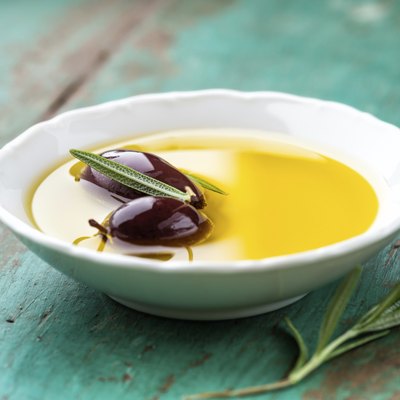 Kalamata olives in a bowl of olive oil