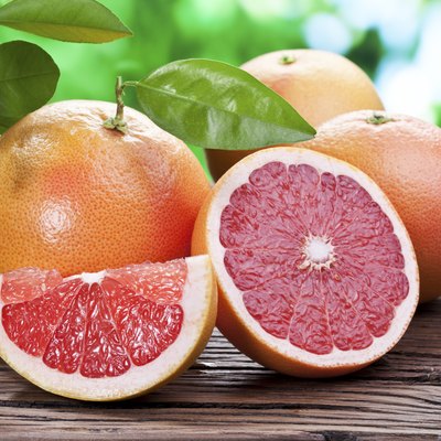 Grapefruits on a wooden table.