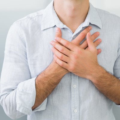 Mid section of a man with chest pain