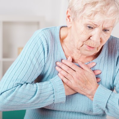 Elderly woman having heart attack