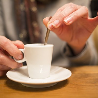 Close up of hands woman and cup of coffee