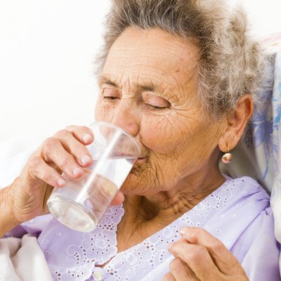 Senior Woman Taking Supplements