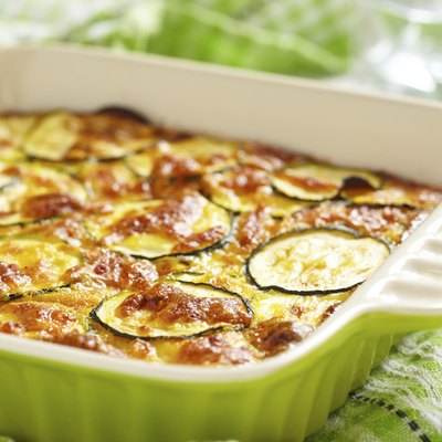 casserole with cheese and zucchini in baking dish