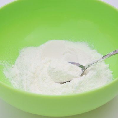 preparing powdered milk in a bowl