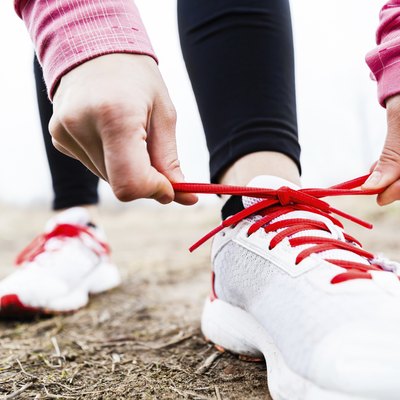 Runner tying sport shoes