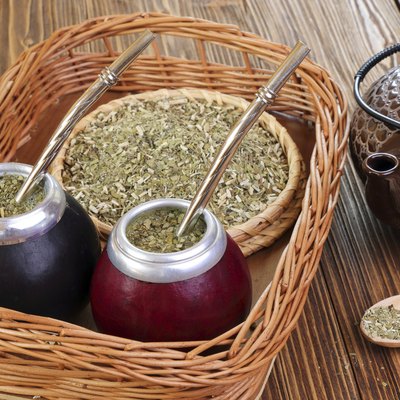 Yerba and mate in calabash on a wicker tray