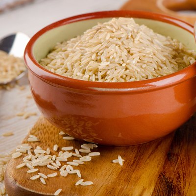 natural brown rice in bowl .