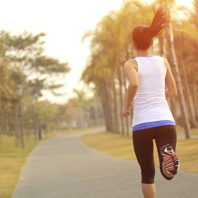 healthy lifetyle asian woman jogging at tropical park
