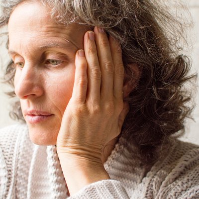 Middle aged woman looking pensive