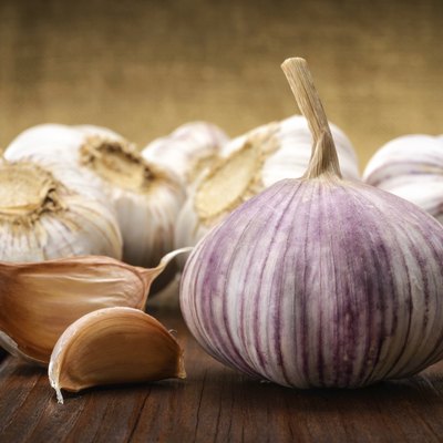 garlic and a whole wooden table closeup