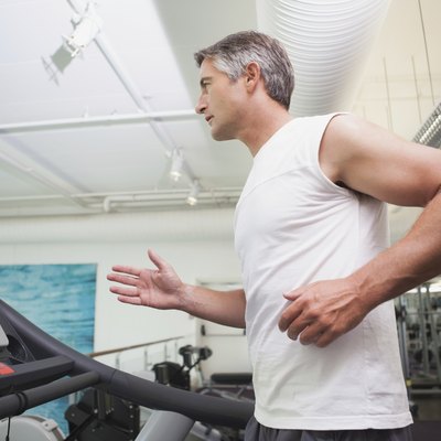 Fit man working out on treadmill
