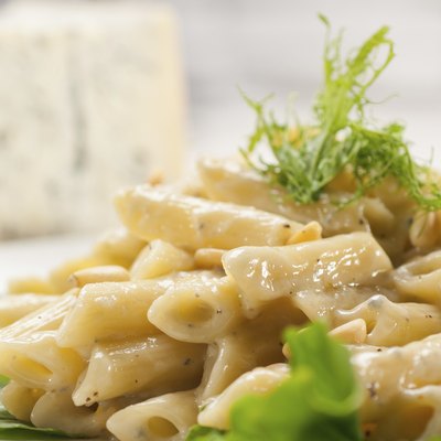 Italian pasta penne gorgonzola and pine nuts