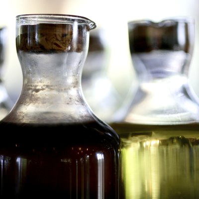 Vinegar and olive oil in a glass bottle