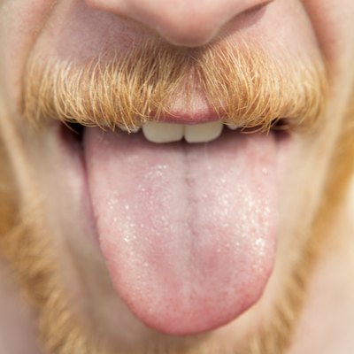 close-up of bearded man sticking out his tongue