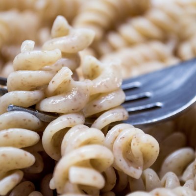 Cooked Plain Brown Wholewheat Fusilli Pasta on a Fork