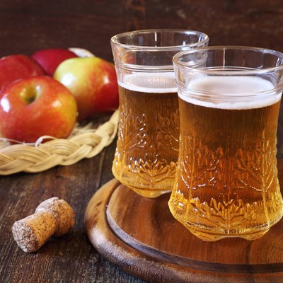 Apple cider and red apples