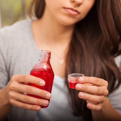 Drinking some cough syrup