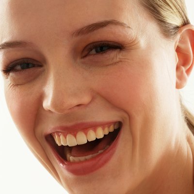 Young woman smiling, portrait, close-up