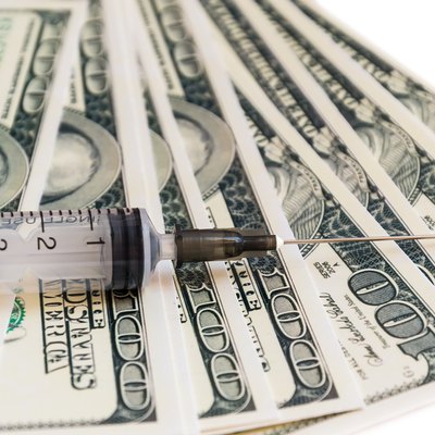 syringe on the money